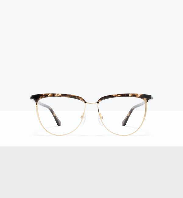 Tortoiseshell cat-eye glasses with a gold frame on a light background.