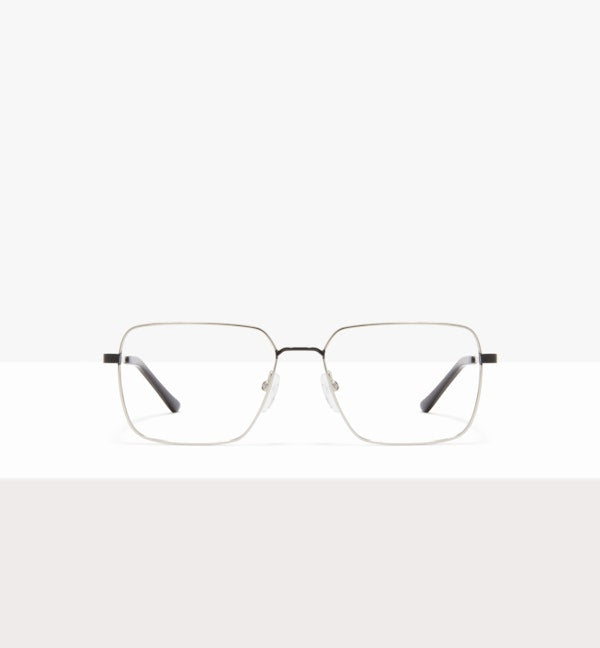Rectangular metal-framed eyeglasses on a white background.