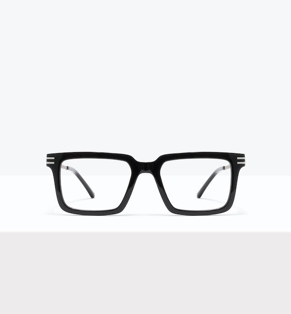 Brown round eyeglasses displayed on a white surface.